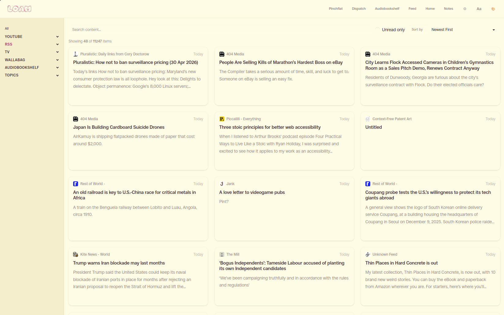 Loam unified feed showing articles from multiple sources in a card grid layout